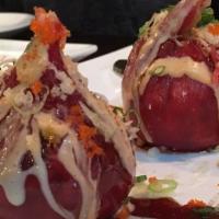 Tuna Dumpling · Blue crab, kani, seaweed salad, crunchy, masago wrapped in tuna & chef special sauce.