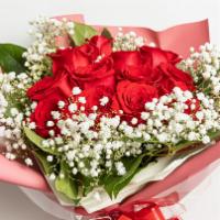 Romantic Moment · This bouquet includes dozen red roses with baby`s breathe. 
Deluxe has 18 red roses
Superior...