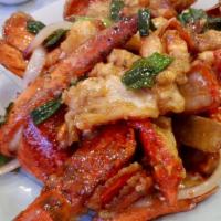 Sautéed Lobster With Ginger And Scallion 薑蔥炒龍蝦 · One lobster. 一隻龍蝦.