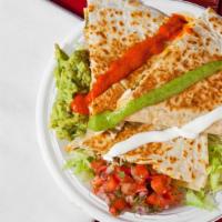Chicken Quesadilla · Most popular. Meat, shredded cheese, onions and peppers, pico de gallo and Mexicrema.