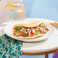 Chicken Shawarma Wrap · Marinated chicken breast with hummus, lettuce, tomato, and red onion drizzled with your choi...