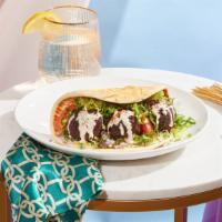 Falafel Wrap · Crispy falafel with hummus, lettuce, tomato, and red onion drizzled with your choice of sauc...