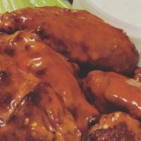 Chicken Wings · Six pieces. Homemade chicken wings with your choice of plain, buffalo or BBQ sauce served wi...