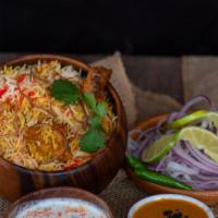 Chicken Dum Biryani · Hyderabadi style spicy chicken ‘on the bone’ and basmati rice served in a dough sealed pot.