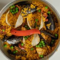 Paella Valencia · Shrimp, clams, scallops, mussels, chicken, chorizo in a saffron rice.
