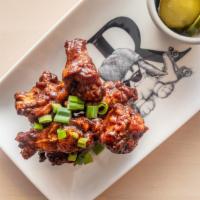 Bbq Jerked Wings · Pickled Cucumber.