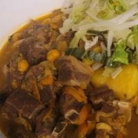 Curry Goat Roti · Halal quaility Goat , Chick peas, potatoes, carrots
