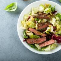 Marinated Steak Salad · Arugula, red onions, mushrooms and balsamic vinaigrette.