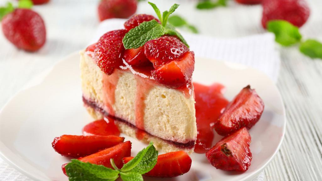 Strawberry Cheesecake · Fresh made creamy cheesecake with a buttery crust and topped with fresh strawberries.