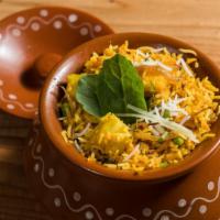 Vegetable Biryani · Hot, gluten free, vegetarian. Assorted fresh vegetables cooked with basmati rice and Indian ...