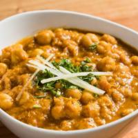 Chana Pindi · A northern Indian specialty, onion, chickpeas, tomatoes, pomegranate seeds.