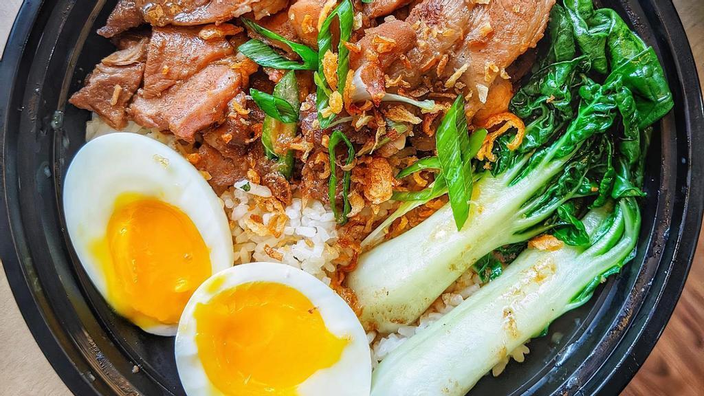 Honey Roasted Pork Over Rice (Char Siu Rice) · Sliced juicy honey roasted pork over garlic rice. Served with soft-boiled soy egg.