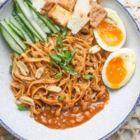Satay Peanut Noodles · Vegetarian. Peanut and sesame sauce, wide egg noodles, soft-boiled egg, cucumbers, crispy on...