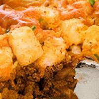 Sloppy Joe Potato Tots · Potato tots, sloppy joe meat, cheese (choice) melted on top, tomato, onion, and sour cream o...