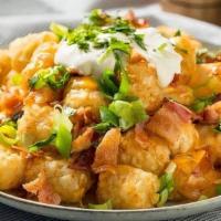 Loaded Potato Tots · Potato tots with cheese (choice) melted on top, onion, bacon, tomato, and sour cream on the ...