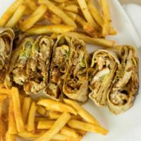 Arabic Chicken Shawarma · Middle Eastern specialty of thinly sliced seasoned chicken, garlic sauce and pickles, wrappe...