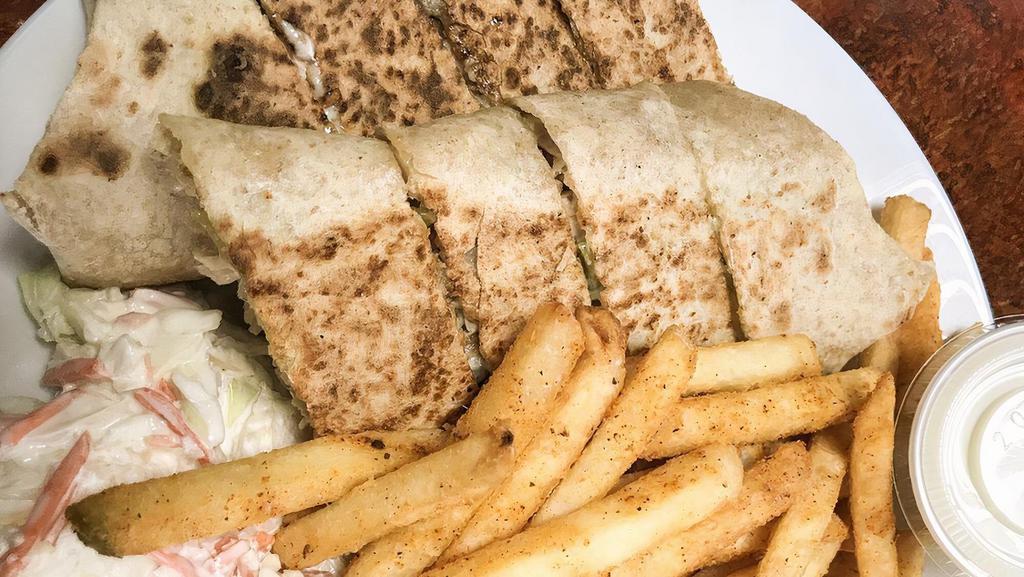 Chicken Shawarma Platter · Middle Eastern specialty assortment of thinly sliced seasoned chicken, with a side of rice or fries, salad, and garlic sauce.