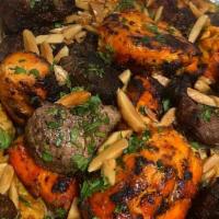 Mixed Grilled Platter · Assortment of lamb kebab, chicken kebab, kofta kebab and Adana kebab. Served with rice and s...
