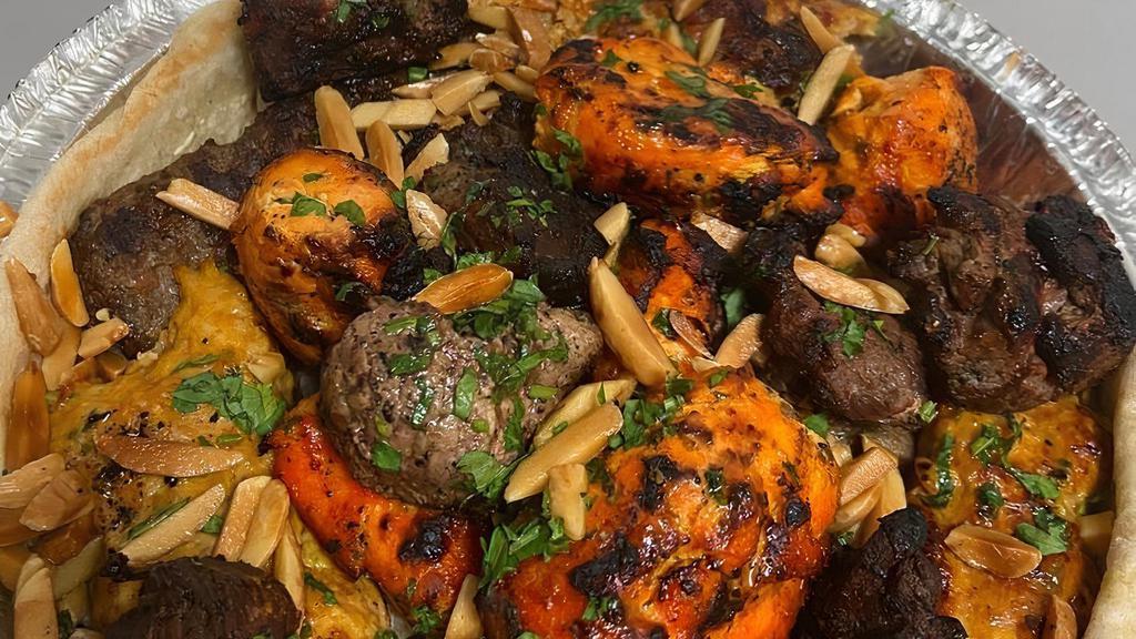 Mixed Grilled Platter · Assortment of lamb kebab, chicken kebab, kofta kebab and Adana kebab. Served with rice and salad.