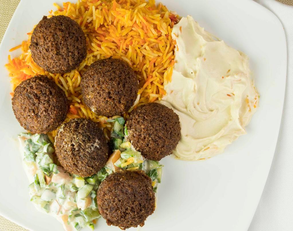 Falafel Platter · Arabic spiced ground chickpeas formed into balls with a side of rice or fries, hummus, tahini salad, and tahini sauce.