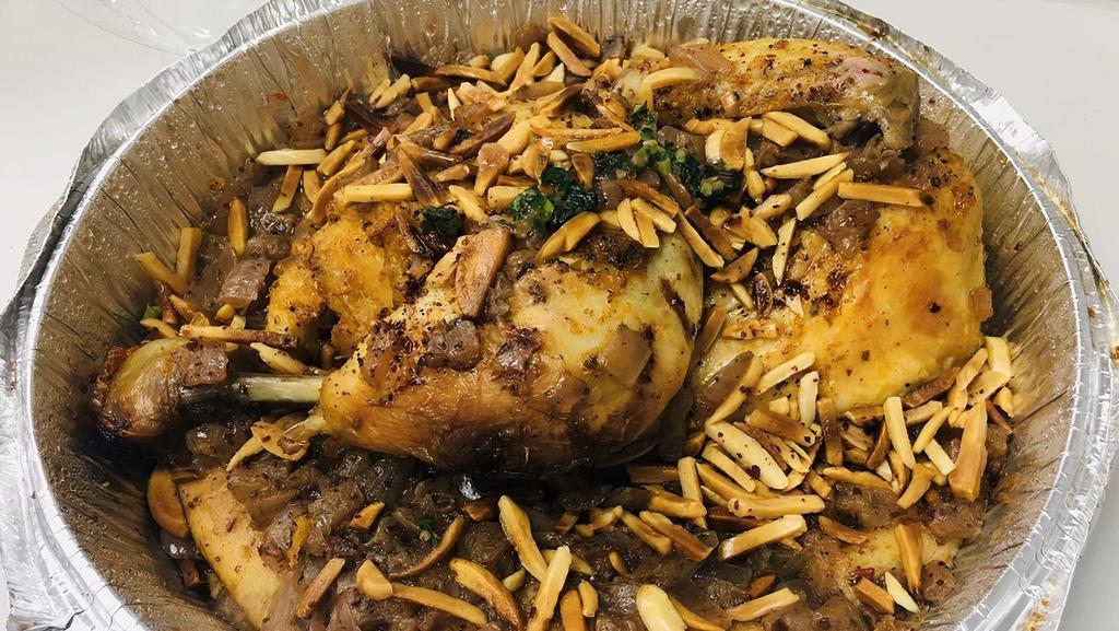 Musakhan Platter · Roasted half chicken baked with onions, olive oil, sumac, allspice, saffron and fried almond. Served over homemade Arabic bread.
