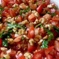 Gavurdagi Salad · Tomatoes cucumbers, onions, parsley, green peppers and walnuts. Served with olive oil and po...