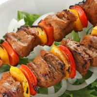 Lamb Shish · Special marinated cubes of baby lamb grilled to delight on skewers served with rice.