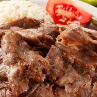 Doner Kebab (Gyro) · Thinly sliced lamb and beef marinated with chef's own secret blend of seasoning, cooked on a...