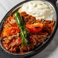Iskender Kebab · Doner kebab served over bread topped with fresh tomato sauce and a healthy portion of fresh ...