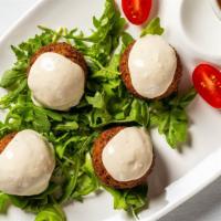 Falafel Appetizer · Deep fried chickpeas and vegetables, blended with middle eastern spices.