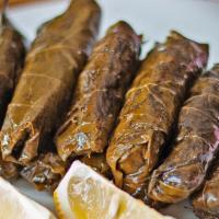 Stuffed Grape Leaves (Dolma) · Homemade grape leaves stuffed with special seasoned rice and pine nuts topped with olive oil.