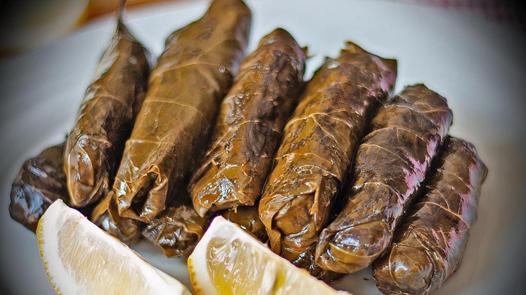 Stuffed Grape Leaves (Dolma) · Homemade grape leaves stuffed with special seasoned rice and pine nuts topped with olive oil.