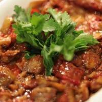 Eggplant With Tomato Sauce · Small pieces of fried eggplant in moderately spicy sauce of fresh tomatoes, green peppers, o...