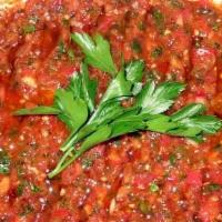 Ezme (Spicy Mashed Vegetables) · A mixture of minced tomatoes, peppers, garlic, onions, walnuts, hot spices, olive oil and le...