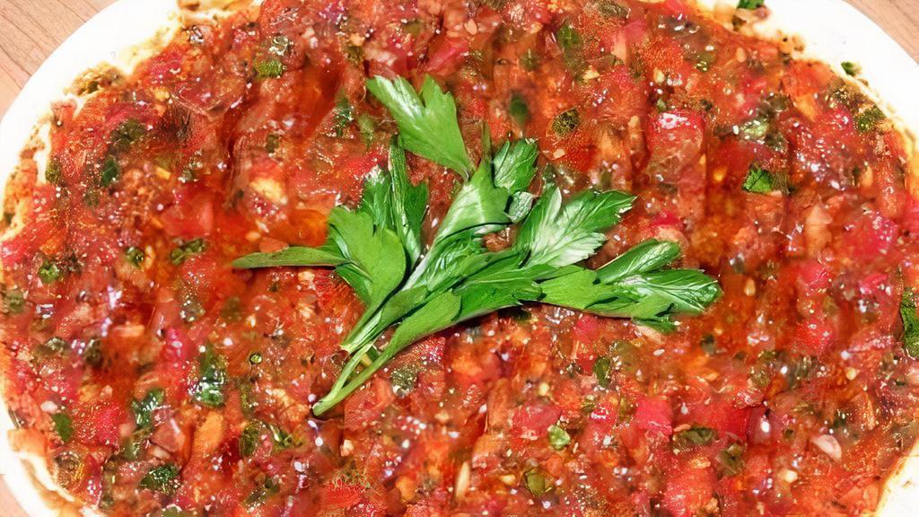 Ezme (Spicy Mashed Vegetables) · A mixture of minced tomatoes, peppers, garlic, onions, walnuts, hot spices, olive oil and lemon juice.