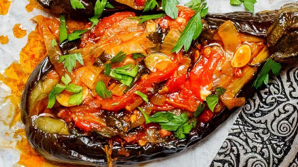 Stuffed Eggplant (Imam Bayildi ) · Whole baby eggplant stuffed with sauteed tomatoes, onions, pine nuts, and herbs cooked with olive oil.