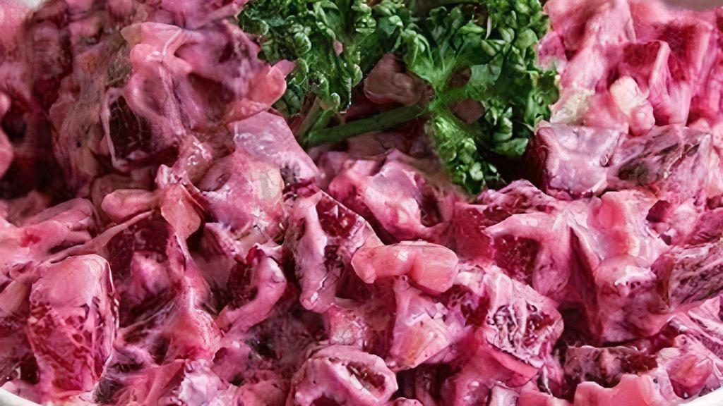 Beetroot Salad With Mayo · One of the iconic salads in all the former USSR countries is a beetroot salad with mayo. Boiled and rapped beetroots are mixed with chopped walnuts and seasoned with mayonnaise. All the dangers of the latter are offset with benefits of the beet.
