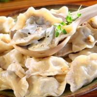 Homemade Potato Pierogies · (6 pcs) Dumplings made with fillings, such as mashed potatoes and fried onions. Served with ...