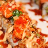 Volcano Roll · Crab tempura, avocado, crunch with spicy lobster, masago, scallion, sweet sauce, and spicy m...