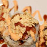 Mexican Roll · Spicy cooked tuna, crab, shrimp with nacho chip flakes, avocado, and salsa sauce.
