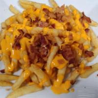 Cheesy Bacon Fries · Seasoned fries with melted American cheese and bacon bits