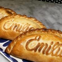 Spinach Empanada · A baked pastry turnover stuffed with Spinach, Aged Cheddar, and Grana Padano,