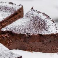 Flourless Chocolate Cake · This flourless cake, featuring both chocolate and cocoa, is rich, rich, RICH! A thick icing ...