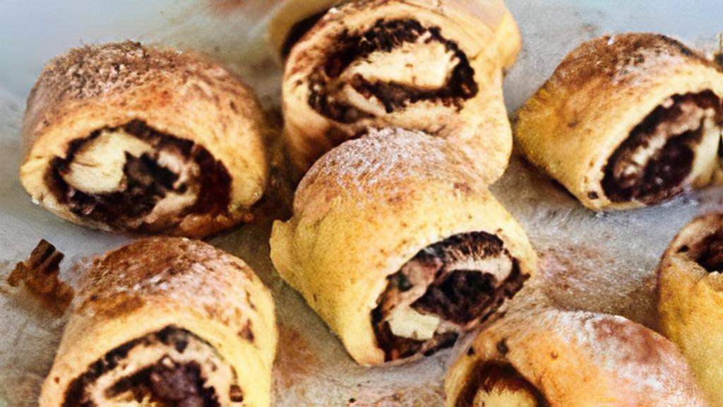Chocolate Rugelach · If you love chocolate, you'll this Chocolate Rugelach - a bite-sized cookie made with dough and filled with dark chocolate.