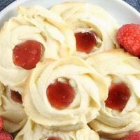 Raspberry Center Butter Cookie · Shortbread thumbprint cookie filled with raspberry jam