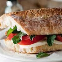 Mini Caprese Sandwich · Mozzarella, tomato, pesto, balsamic, olive oil, arugula on a 3