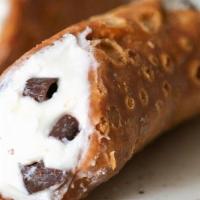 Cannoli · A crispy pastry shell filled with a sweet, creamy ricotta and chocolate chip mixture —a stap...