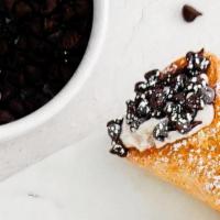 Mini Cannoli · A crispy pastry shell filled with a sweet, creamy ricotta and chocolate chip mixture.