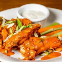 Buffalo Chicken Wings · Six pieces, with celery, carrots and blue cheese dressing.