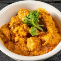 Butter Chicken · Chicken prepared in butter gravy with addition of cream which gives the curry sauce a smooth...